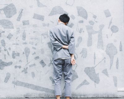 man and wall